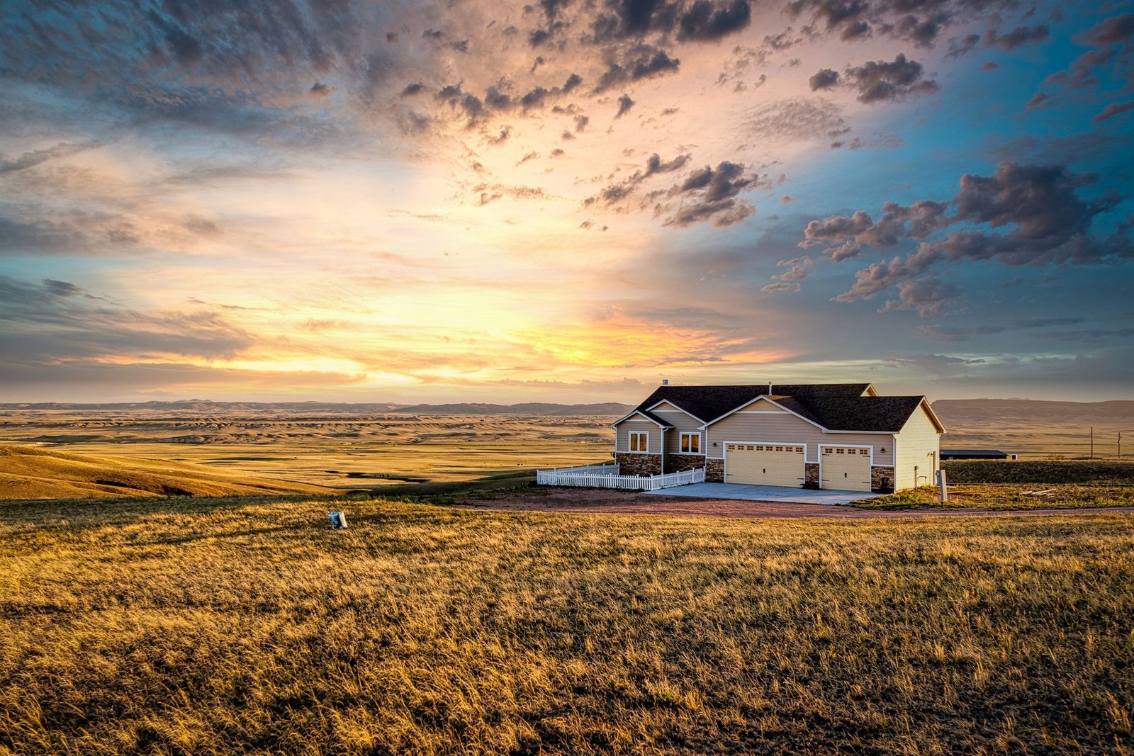 Wyoming home on the open prairie at sunset