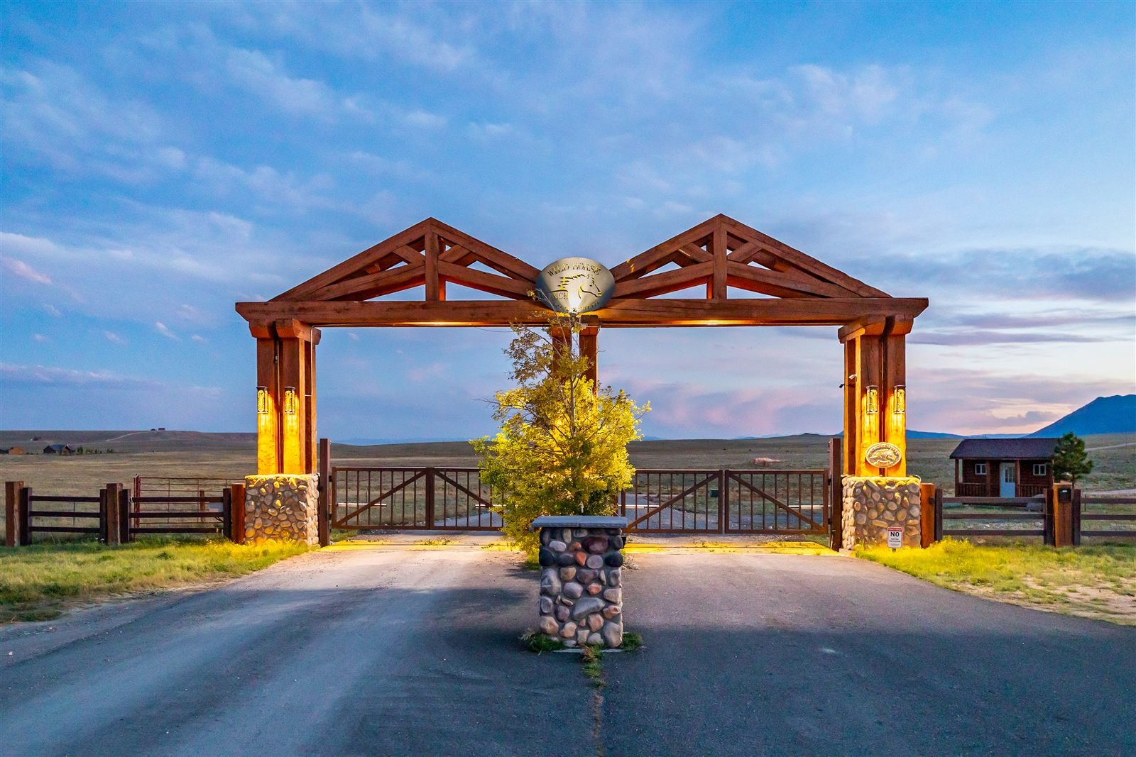 Wild Horse Ranch entrance gate at dusk
